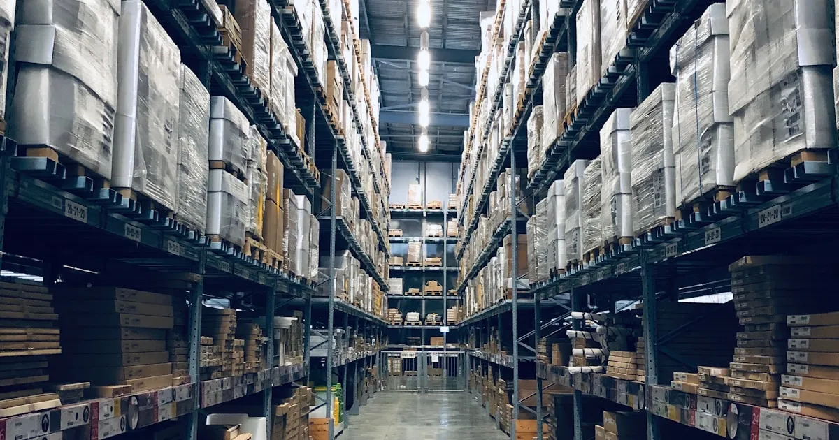 Warehouse staff in an Indonesian ecommerce fulfillment center organizing shelved inventory for marketplace orders