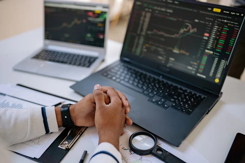 Person using a laptop to review sales data and stock trends