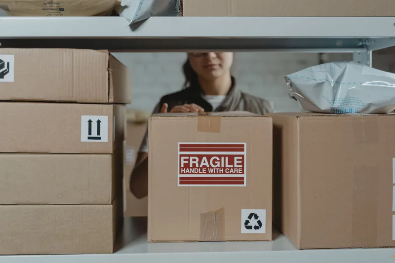 Cardboard boxes organized in a warehouse for multi-channel order fulfillment