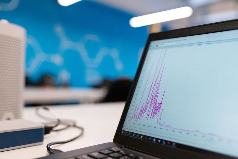 Laptop screen showing a stock-level trend graph, the kind of data view inventory software generates automatically