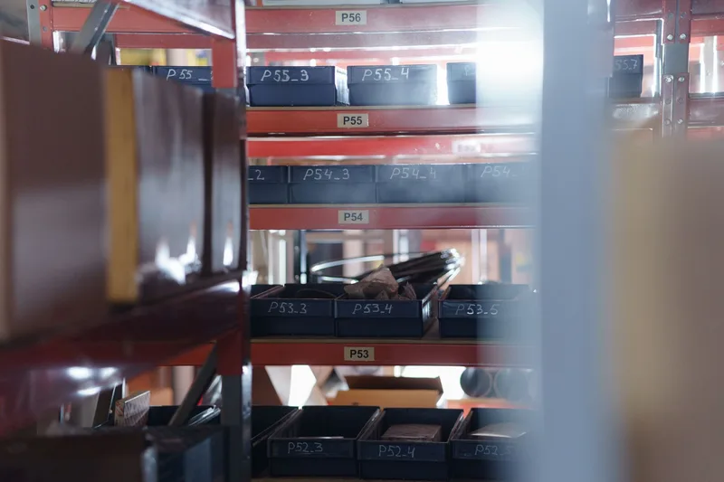 Organized warehouse shelving unit with numbered bins for inventory storage